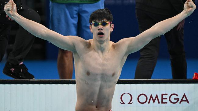 China's Pan Zhanle reacts after winning gold and breaking a world record in the final of the men's 100m freestyle swimming event during the Paris 2024 Olympic Games. Picture: Jonathan Nackstrand/AFP