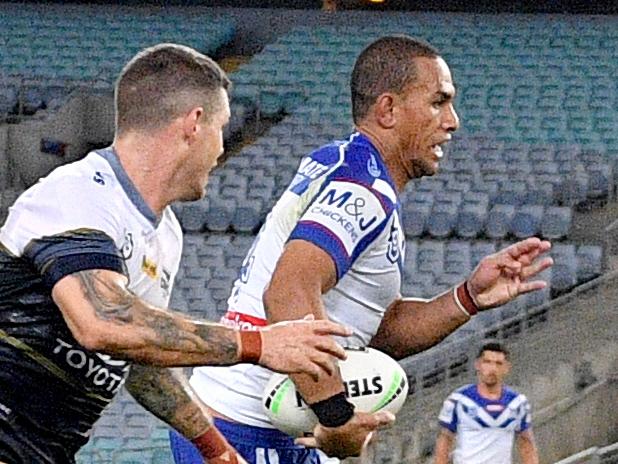 Will Hopoate of the Bulldogs makes a break during the round two NRL match between the Canterbury-Bankstown Bulldogs and North Queensland Cowboys at ANZ Stadium, in Sydney, Thursday, March 19, 2020. (AAP Image/Dan Himbrechts) NO ARCHIVING, EDITORIAL USE ONLY