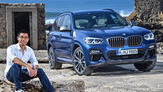 BMW designer Calvin Luk with his latest creation, the X3. Pic: Supplied.