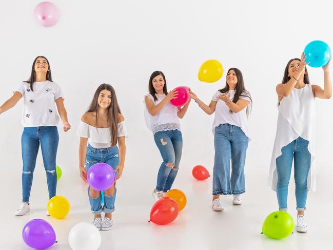 Fatima Dib, centre, instils strong money skills in daughters Elyssar, Zahra, Jenan and Nadine Dib. Picture: Lee Bird Photography