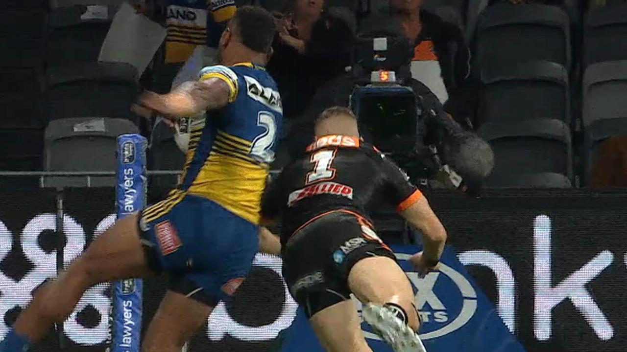 Adam Doueihi shoulder charges Maika Sivo into touch.