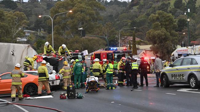 Emergency services personnel at the latest crash at the bottom of the South Australian Freeway. Picture: Keryn Stevens