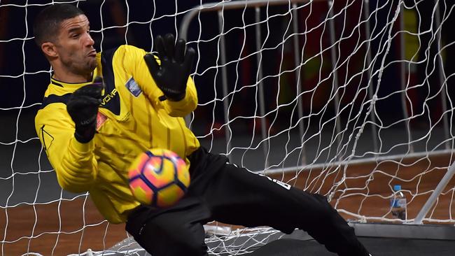 Liverpool Legends goalkeeper David James makes a save.