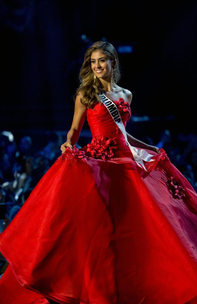 … and her vibrant, red gown.