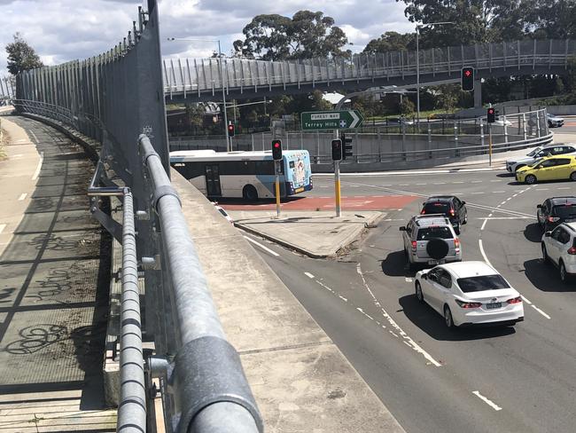 A 60cm wide ledge that graffiti vandals have been using to spray paint on to glass panels along a pedestrian walkway above the intersection of Warringah Rd and Forest Way at Frenchs Forest. Picture: Jim O'Rourke