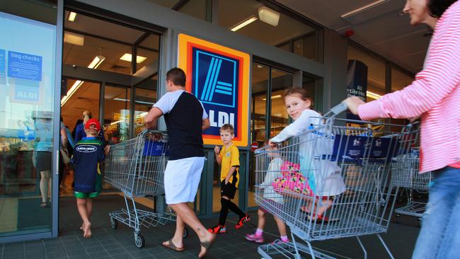 Keen shoppers line up outside Alid Supermarket hoping to grab bargains. Picture: Claudia Baxter