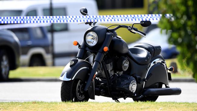 A motorcycle near police tape surrounding the crime scene. Picture: AAP Image/Joe Castro