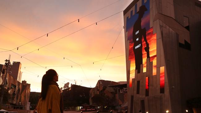 A screen with Lest We Forget on display in Federation Square. Picture: David Crosling