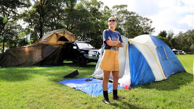 Bluesfest Ticket holder Jasmine Barton starts the slow process of packing up her camp site after being informed the event had been cancelled at the last minute. Picture: NCA NewsWire / Scott Powick