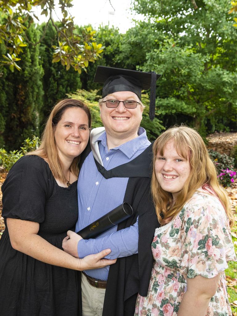 Bachelor of Commerce and Bachelor of Laws graduate Joseph Marshall with Chloe (left) and Paige Marshall at the UniSQ graduation ceremony at Empire Theatres, Tuesday, December 13, 2022. Picture: Kevin Farmer