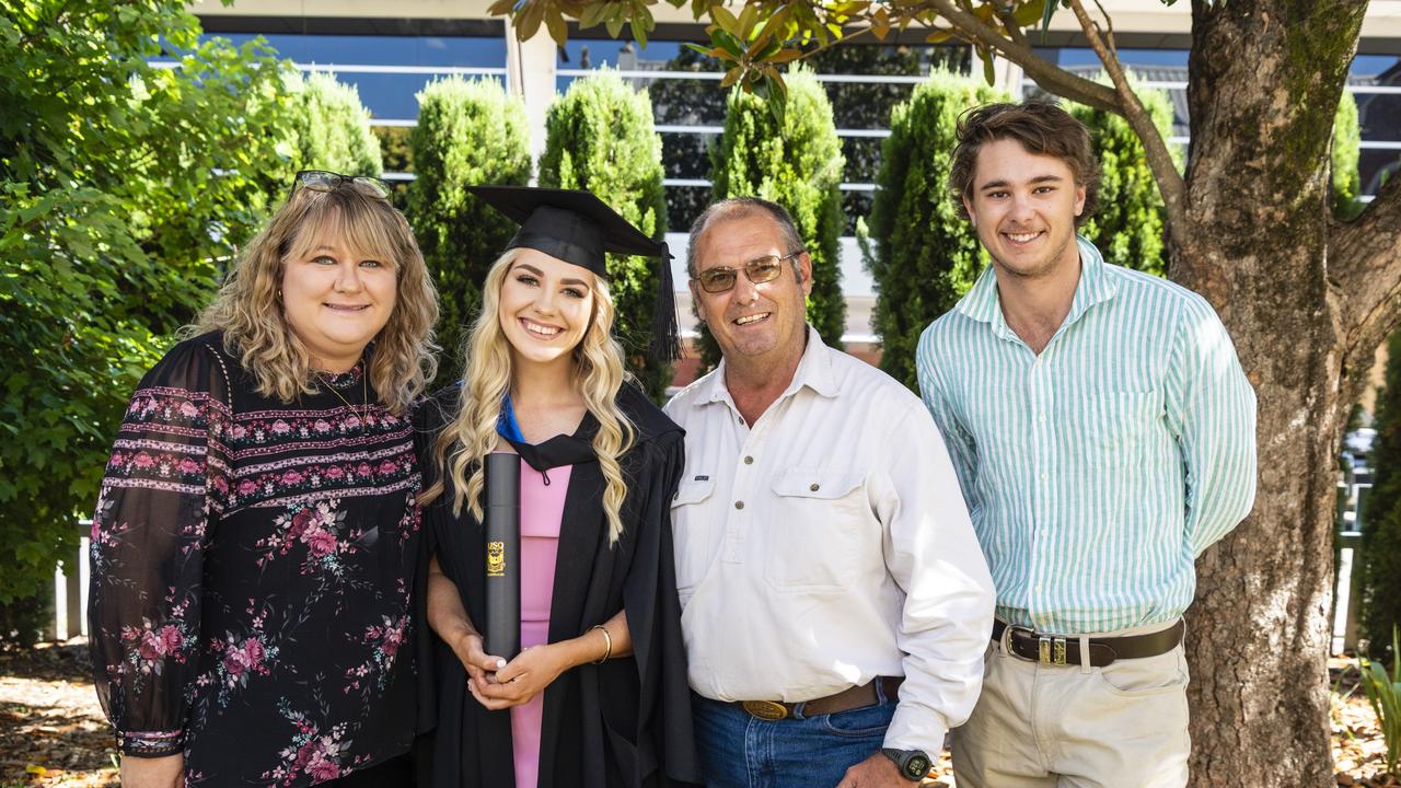 Bachelor of Sport and Exercise Science (First Class Honours) graduate Erin Wallace with mum Elaine Wallace, dad Travers Wallace and Thomas Pearce at the UniSQ graduation ceremony at Empire Theatres, Wednesday, December 14, 2022.