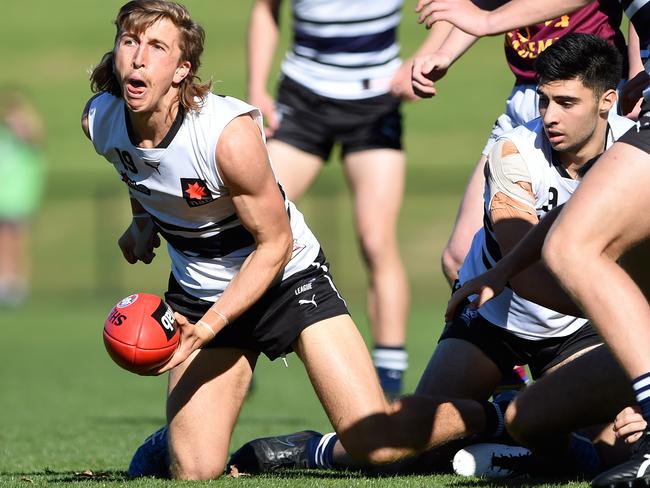 NAB League Football: Northern Knights v Brisbane Lions Academy at Preston City Oval. Joel Trudgeon looks to hand pass away. Picture: Steve Tanner