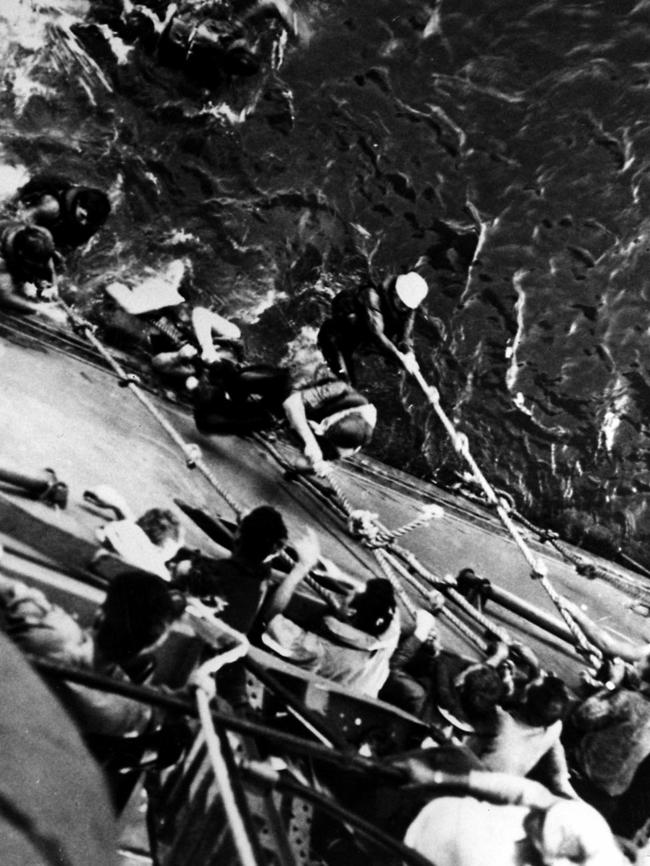 Survivors from the aircraft carrier USS <i>Lexington</i> are pulled aboard USS <i>Minneapolis</i> after their ship sank during the Battle of the Coral Sea.