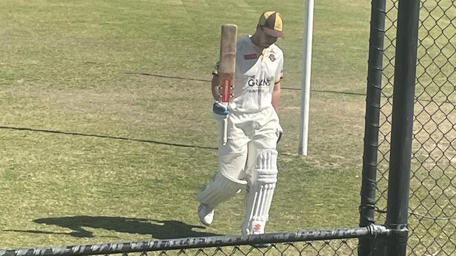 Heatherhill centurion Kristian Miller raises his bat on Saturday. Pic: Tyler Lewis