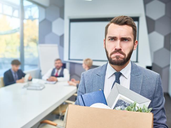 CAREERS: Portrait of sad bearded businessman holding box of personal belongings being fired from work in company, copy space.Unfair dismissal. Fired. iStock.