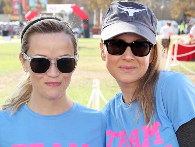 Relaxed ... Reese Witherspoon, left, and Renée Zellweger pose for a photo together at the Los Angeles Walk To Defeat ALS as part of “Team Nanci” in support of publicist Nanci Ryder who was diagnosed with ALS. Picture: Matt Sayles/Invision/AP.