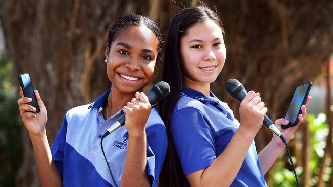 Pimlico State High School students Eunice Bona and Claire Curtis will be debating about the use of mobile phones in schools. Picture: Zak Simmonds