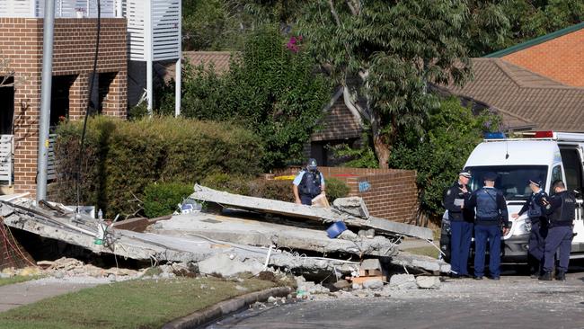 Emergency services on Waikanda Crescent in Whalan on Monday where debris from an explosion has been cleared out onto the street. A woman's body has been found. Picture: NewsWire / Damian Shaw