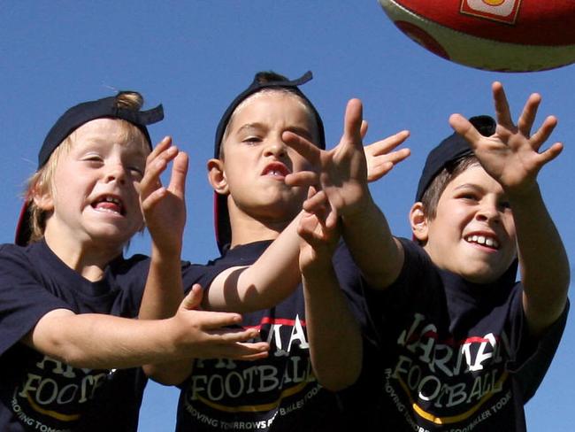 Players of the future - James Rowe (son of footballer Stephen Rowe), Jackson Edwards (son of Tyson Edwards) and Ben Jarman (son of Darren Jarman) show their skills.