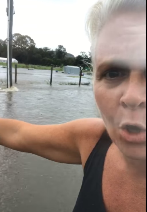 Danni Crowe at the Mudgeeraba flood waters.