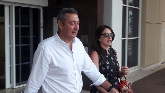 Real estate agent Chris Deutrom leaves the NT Supreme Court with his wife, Helen