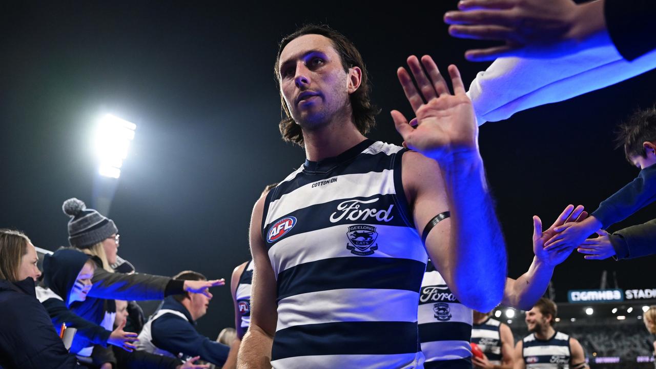 GEELONG, AUSTRALIA - JULY 06: Jack Henry of the Cats celebrates with fans as he leaves the field after winning the round 17 AFL match between Geelong Cats and Hawthorn Hawks at GMHBA Stadium, on July 06, 2024, in Geelong, Australia. (Photo by Daniel Pockett/Getty Images)