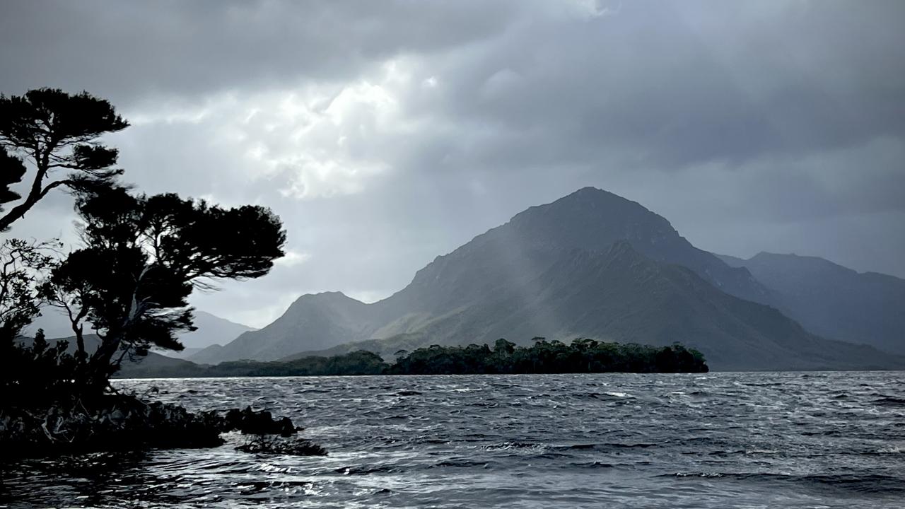 Showers sweep across Mt Rugby views from the Celery Top Islands in Bathurst Harbour. Picture: Philip Young