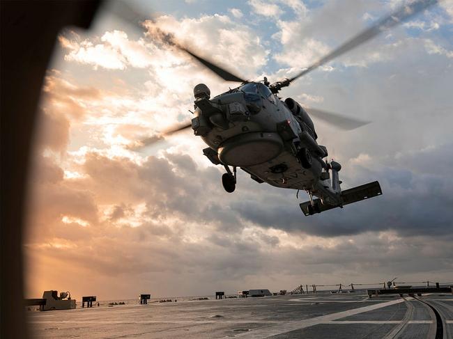 HMAS Brisbane’s embarked MH-60R helicopter, ‘Nomad’, departs for an air warfare serial, as the ship sails off the coast of Queensland during Exercise Talisman Sabre 2021. Picture: ADF