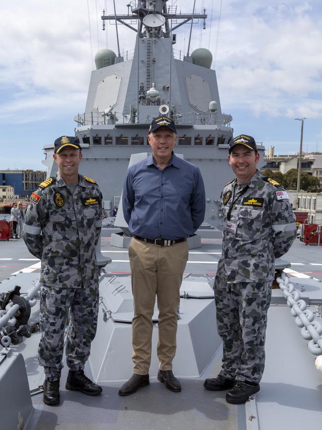 Peter Dutton, centre, with former chief of navy Vice-Admiral Michael Noonan, left, and former HMAS Sydney commanding officer Andrew Hough at Garden Island in Sydney in 2021. Picture: Defence