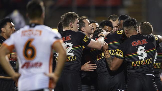 SYDNEY, AUSTRALIA - AUGUST 29: Jarome Luai of the Panthers is congratulated by team mates after scoring a try during the round 16 NRL match between the Panthers and the Wests Tigers at Panthers Stadium on August 29, 2020 in Penrith, Australia. (Photo by Brett Hemmings/Getty Images)