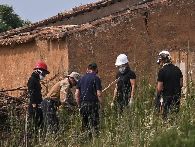 German investigators searched undergrowth and an abandoned building in Portugal. Picture: AFP
