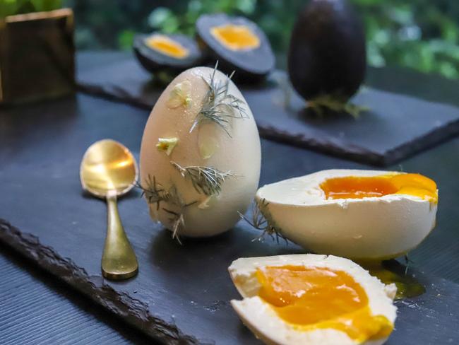 The mango filling inside KOI Dessert Bar’s white chocolate Easter eggs look like egg yolks. Picture: Jenifer Jagielski