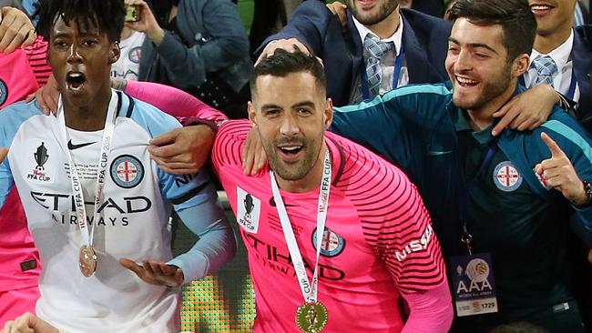 Dean Bouzanis celebrates with his City teammates after winning the FFA Cup. Picture: Wayne Ludbey