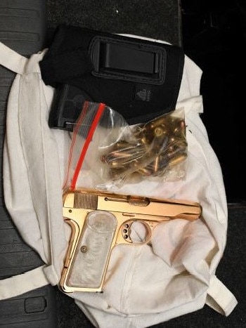 A golden gun and bullets seized by Australian Federal Police in the raid.