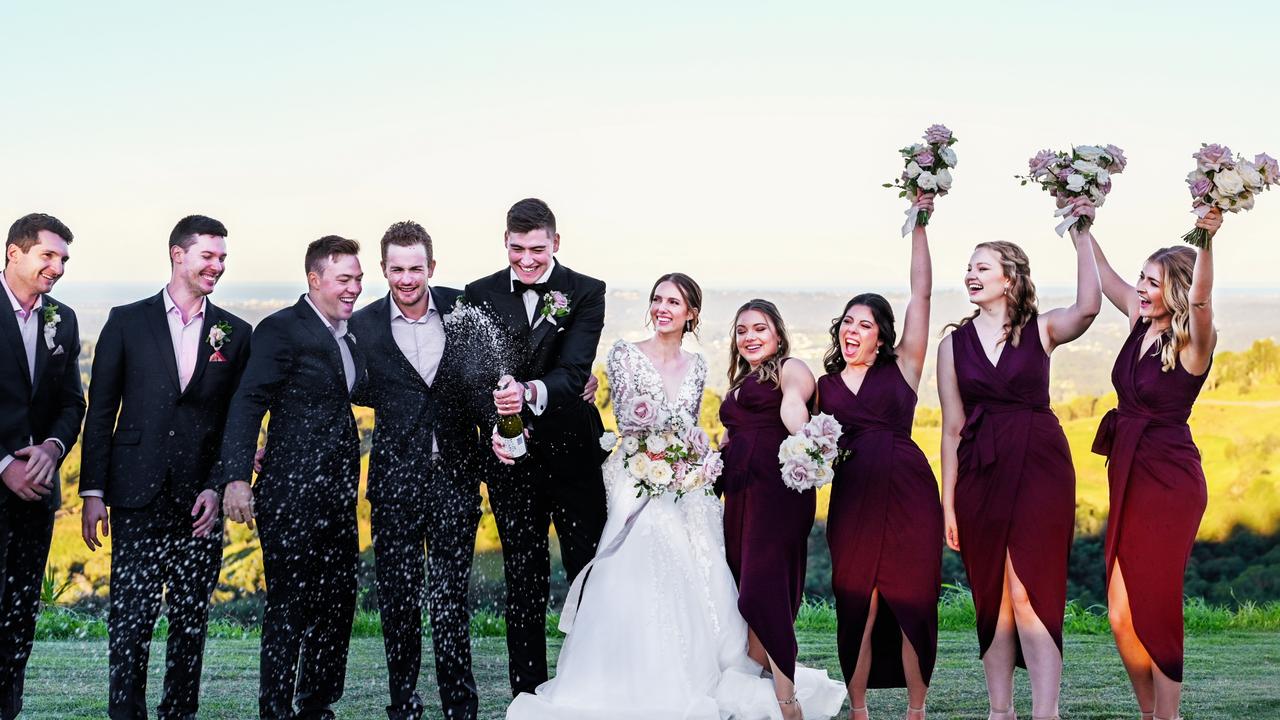 The wedding party celebrate with champagne. Picture: Sally/Ted &amp; Li Photography