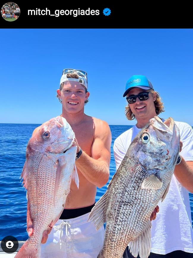 Mitch Georgiades catches a fish on the AFL holiday break.