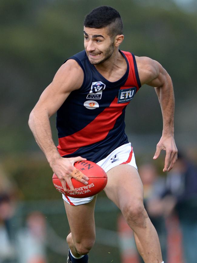 Adam Saad sets off on a run for Coburg. Picture: Steve Tanner