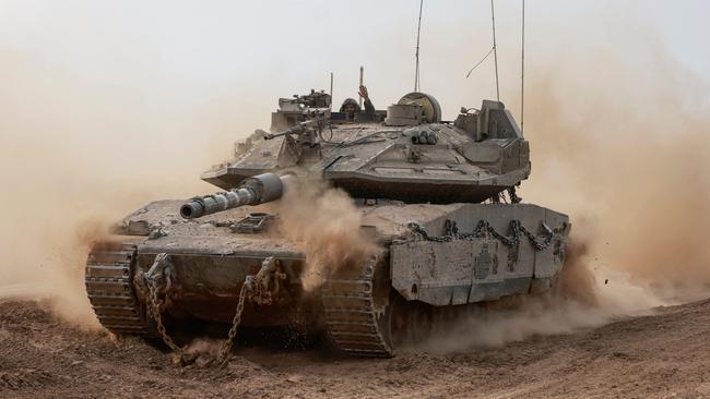 An Israeli tank rolls out of Gaza at the weekend. Picture: AFP