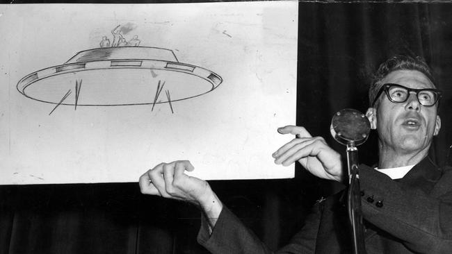 In October 1959, Rev. William Gill at a meeting of the Victorian Flying Saucer Society holds up a diagram of one of the flying objects he said he saw while on a mission station in New Guinea.