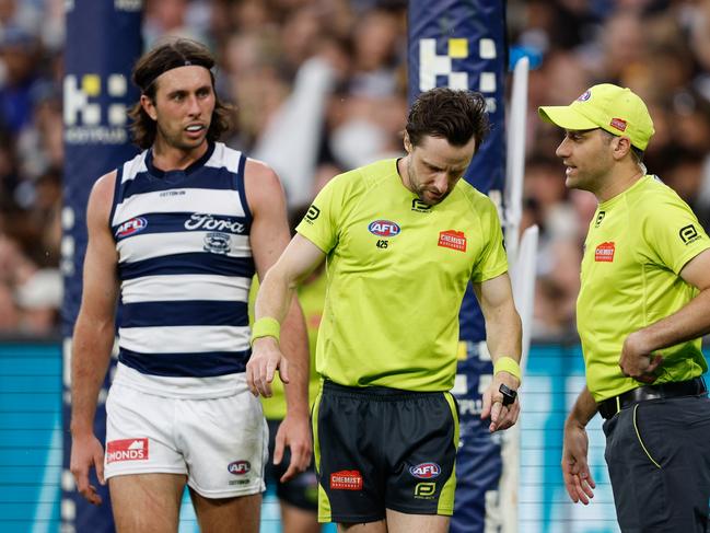 AFL field umpire Brendan Hosking and AFL goal umpire Steven Piperno request a score review during the Easter Monday clash. Picture: Dylan Burns/AFL Photos via Getty Images.