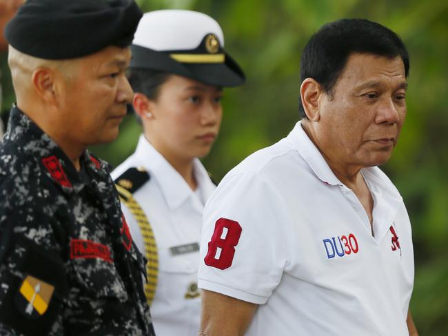 Philippine President Rodrigo Duterte visits the Philippine Army Scout Rangers at their headquarters at Camp Tecson in San Miguel township, north of Manila, Philippines Thursday, Sept. 15, 2016. A former Filipino militiaman testified before the country's Senate that President Duterte, when he was still a mayor, ordered him and other members of squad to kill criminals and opponents in assaults that left about 1,000 dead. (AP Photo/Bullit Marquez)