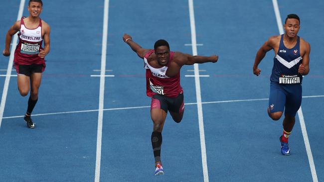 Prosper Nwoko of Queensland wins the Boys under 17 100m final. (Photo by Mark Metcalfe/Getty Images)