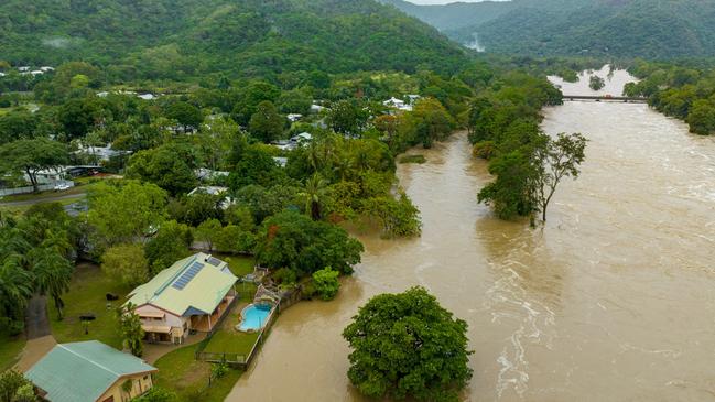 The Barron River in flood after cyclone Jasper on the northern side of Cairns. Photo Supplied: Cockatours