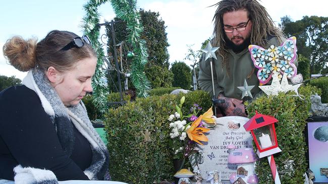 Sharnae Kelly and Brody Van Dreumel by the grave of their daughter Ivy Louise. Picture: Alan Barber