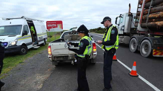 Police at a check point on Glenelg River Rd near Nelson. The border between Victoria and South Australia. Picture: Tait Schmaal.