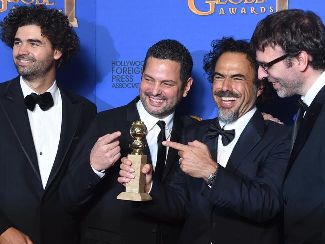 Flying high ... Alejandro González Iñárritu (2R), Nicolás Giacobone, Armando Bo and Alexander Dinelaris pose with the Golden Globe award for Best Screenplay - Motion Picture for Birdman. Picture:  AFP