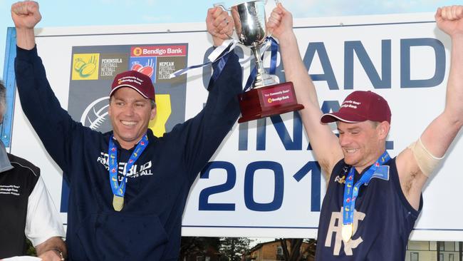 Rosebud coach Nick Jewell and captain Ryan Spooner with the 2015 premiership trophy. Picture: Andrew Henshaw