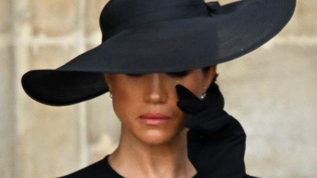 The Duchess of Sussex wipes away a tear at the Queen’s funeral. Picture: Tim Rooke/Shutterstock