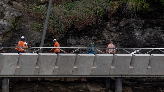 Workers add the finishing touches to the boardwalk in March. Picture: Monique Harmer