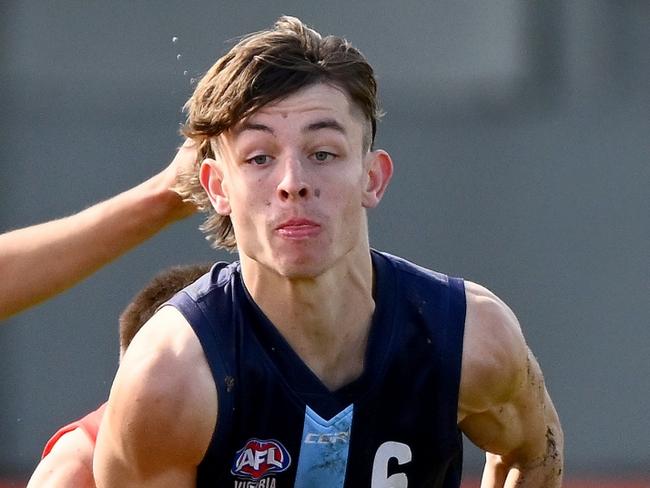 MELBOURNE, AUSTRALIA - MAY 07: Kynan Brown of Vic Metro handballs during the match between the Young Guns and Vic Metro at Trevor Barker Beach Oval on May 07, 2023 in Melbourne, Australia. (Photo by Morgan Hancock/AFL Photos via Getty Images)